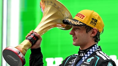 Winner Mercedes' Italian driver Kimi Antonelli celebrates on the podium after the Formula One Chinese Grand Prix at the Shanghai International Circuit in Shanghai on March 15, 2026. (Photo by Greg Baker / AFP)
