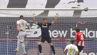 Real Madrid forward Karim Benzema heads the ball at goal. AFP