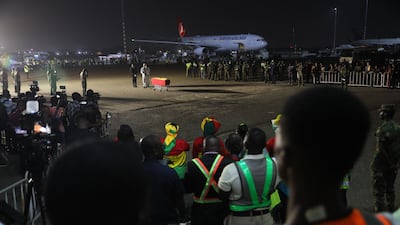 The coffin containing the remains of former Ghana international football player Christian Atsu arrive at Kotoka International Airport in Accra, Ghana, on February 19, 2023. AFP