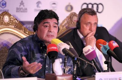 Diego Maradona, the new chairman of Belarus club Dynamo Brest, left, and Valdas Ivanauskas, the club's vice chairman, at a press conference held at Emirates Palace hotel in Abu Dhabi. Pawan Singh / The National