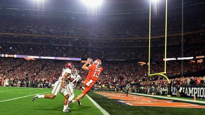 Hunter Renfrow #13 of the Clemson Tigers catches a 31 yard touchdown pass from Deshaun Watson #4 in the first quarter against the Alabama Crimson Tide during the 2016 College Football Playoff National Championship Game at University of Phoenix Stadium on January 11, 2016 in Glendale, Arizona. Harry How/Getty Images/AFP