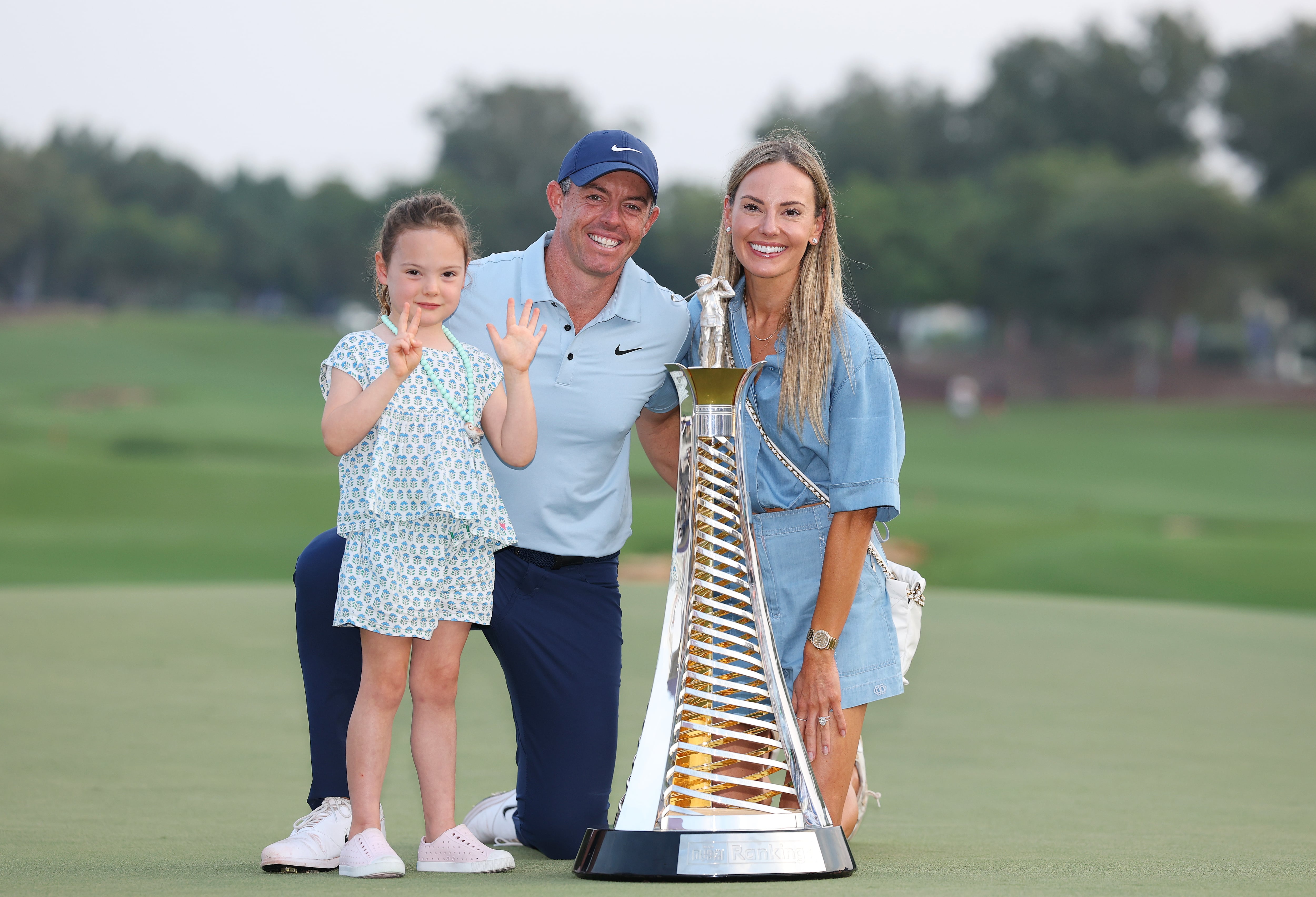 Rory McIlroy celebrates with daughter Poppy and wife Erica after winning his seventh Race to Dubai crown at Jumeirah Golf Estates on November 16, 2025. Getty Images