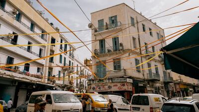 Red and gold streamers over the streets in Bab Souika on match day. Erin Clare Brown/ The National
