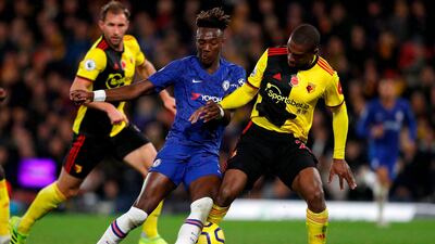 Chelsea's English striker Tammy Abraham (L) is tackled by Watford's Dutch defender Daryl Janmaat during the English Premier League football match between Watford and Chelsea at Vicarage Road Stadium in Watford, north of London on November 2, 2019. RESTRICTED TO EDITORIAL USE. No use with unauthorized audio, video, data, fixture lists, club/league logos or 'live' services. Online in-match use limited to 120 images. An additional 40 images may be used in extra time. No video emulation. Social media in-match use limited to 120 images. An additional 40 images may be used in extra time. No use in betting publications, games or single club/league/player publications. / AFP / Adrian DENNIS / RESTRICTED TO EDITORIAL USE. No use with unauthorized audio, video, data, fixture lists, club/league logos or 'live' services. Online in-match use limited to 120 images. An additional 40 images may be used in extra time. No video emulation. Social media in-match use limited to 120 images. An additional 40 images may be used in extra time. No use in betting publications, games or single club/league/player publications.