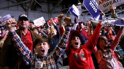 Young supporters cheer as U.S. President Donald Trump speaks during a campaign rally in Tupelo, Mississippi, U.S. Reuters