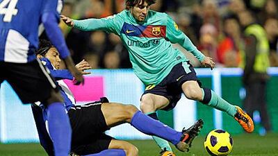 Lionel Messi takes a shot during Barca's 3-0 victory against Hercules.