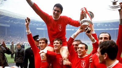 Liverpool captain Ron Yeats, top, after winning the FA Cup in 1965, celebrates with teammates (left to right) Geoff Strong, Wilf Stevenson, Peter Thompson, Ian St John, Gerry Byrne and Ian Callaghan. PA