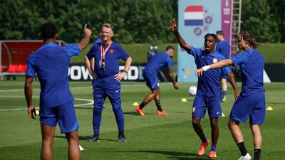 Netherlands coach Louis van Gaal with Jeremie Frimpong and Xavi Simons at training. Reuters