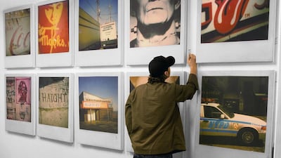 Dubai's Julian Castaldi putting the final touches to an exhibition of Polaroids