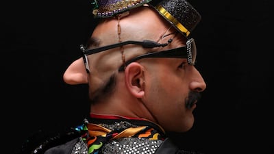 A participant of the international World Beard and Moustache Championships poses before taking part in one of the 17 categories of beard and moustache styles competing in Antwerp, Belgium. Reuters