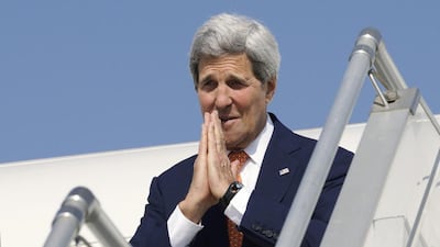 US secretary of state John Kerry gives the traditional Indian greeting before departing India at the airport in Ahmedabad on January 12. Rick Wilking / Reuters