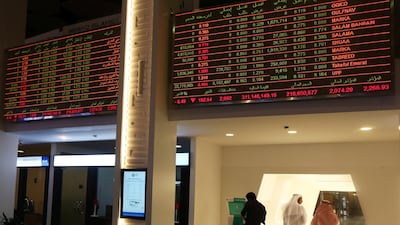 Investors are seen at the Dubai International Financial Market in Dubai, UAE. Reuters
