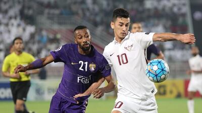 El Jaish's Sardor Rashidov, right, during the Asian Champions League match against Al Ain on October 18, 2016. AFP