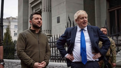 Ukrainian President Volodymyr Zelenskyy, left, and British Prime Minister Boris Johnson walk in downtown Kyiv, Ukraine, on April 9. Ukrainian Presidential Press Office / AP