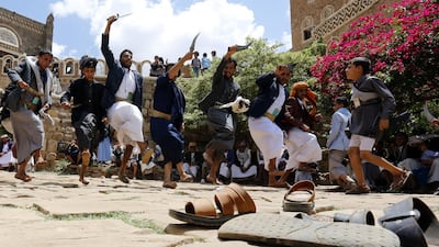 Yemenis perform a traditional dance to celebrate the Eid al-Fitr at a tourist site on the outskirts of Sanaa, Yemen. EPA