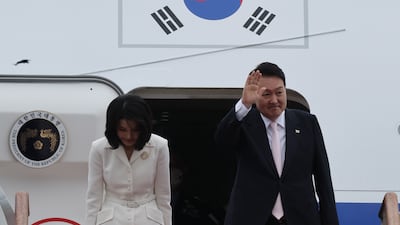 South Korea's first couple board a plane in Seoul as they head to Madrid to attend a Nato summit, in June 2022. EPA