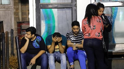 Friends of victims wait at a hospital after a fire that killed and injured several people in Mumbai on December 28, 2017. Most of those who died were young women attending a birthday party. Danish Siddiqui / Reuters