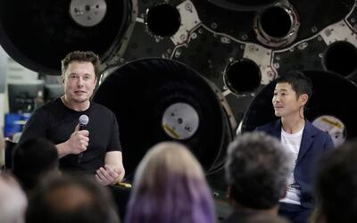 SpaceX founder Elon Musk, left, introduces Japanese billionaire Yusaku Maezawa, right, as the first private passenger on a trip around the moon. Chris Carlson / AP