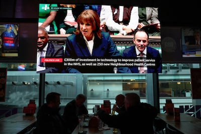 Chancellor Rachel Reeves's budget presentation is shown on a TV screen in London's City district. Reuters.