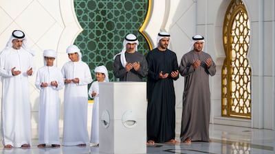 Sheikh Mohamed bin Hamad, Adviser to the President, Sheikh Zayed bin Mohamed, Sheikh Hamdan bin Mohamed, Deputy Chairman of the Presidential Court for Special Affairs, Sheikh Zayed bin Omar and Sheikh Omar bin Zayed pray at the grave of Sheikh Zayed
