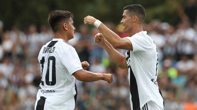 Ronaldo, right, celebrates with Paulo Dybala. Getty Images