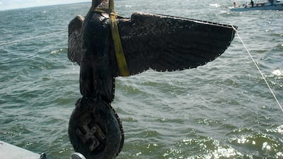 The eagle from the stern of German battleship the Graf Spee, scuttled on December 17, 1939 off the coast of Montevideo, is recovered from the depths of the estuary. AFP