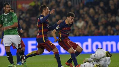 Barcelona’s Munir El Haddadi and Adriano, left, attack the ball during their match against Villanovense on Wednseday night at the Camp Nou. Lluis Gene / AFP