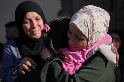 Mourners react as bodies of Palestinians killed by Israeli fire are brought to a hospital in Deir El Balah. AP