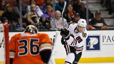 Patrick Kane, centre, takes the shot but how many of his Chicago Blackhawks teammates helped put him in that position? Sean M Haffey / AFP