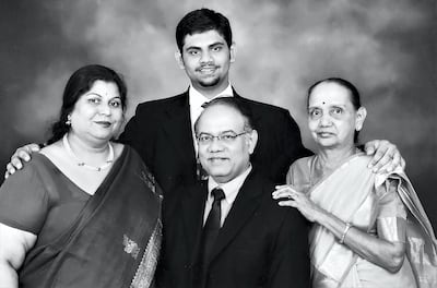 A passion for collecting runs in the family for Sunil Baboo, seated, with family including wife, Alpana (left). Courtesy Flint-Culture