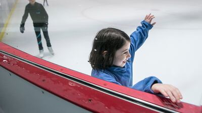 Children at the ice skate rink in Zayed Sports City. Silvia Razgova / The National