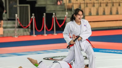 Abu Dhabi, UAE, March4 ,2018. Jiu Jitsu World Championship Juniors and Aspirants 2018. Women's Under 18 Duo. The Thailanf team in action during their match vs. Greace. (R) Phaophan Panyaporn twists the arm of Phaophan Kanyarat. Victor Besa / The National Sports
