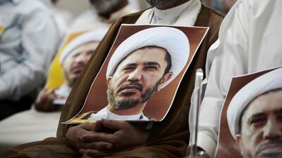 The Bahrain TV report said Qatar's former prime minister, Sheikh Hamad bin Jassem, contacted Ali Salman - seen above in images carried by his supporters - and asked him to urge protesters to flood the streets and ramp up pressure on the state. Mohammed Al Shaikh / AFP