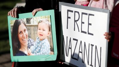 Demonstrators hold placards before a march in support of Nazanin Zaghari-Ratcliffe in November. Peter Nicholls / Reuters