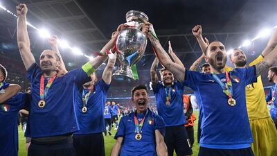 Italy celebrate with the trophy after they beat England 3-2 on penalties to win the Euro 2020 final at Wembley. PA