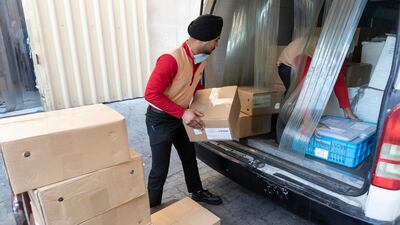Sweets are loaded onto a van for delivery.