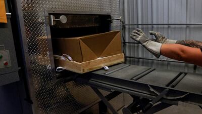 The body of a person who died from Covid-19) is pushed to be cremated by the Farmington Funeral Home in New Mexico, US. Reuters