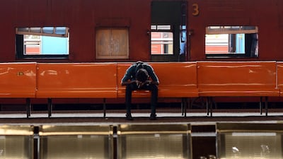 A Sri Lankan passenger sleeps on a bench during a nationwide railway strike at the Fort Railway Station in Colombo. Lakruwan Wanniarachchi / AFP Photo