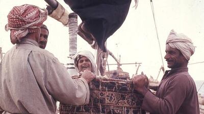 The crew bagging a sail.