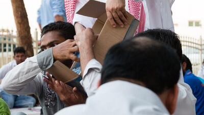 Water is handed out during iftar at the Jumeirah Grand Mosque in Dubai on the first day of Ramadan. Duncan Chard for The National