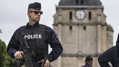 French police officers secure the perimetre around the church in Saint-Etienne-du-Rouvray where, a day before, a priest was killed by two attackers claiming allegiance to ISIL. Ian Langsdon/EPA