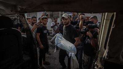 Bodies of Palestinians are brought to Al Shifa Hospital after an Israeli air strike at Al Shati Camp in the Gaza Strip on July 11