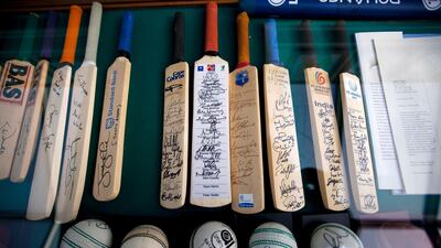 A bat signed by the Australian batting legend Don Bradman has pride of place alongside his batting statistics, while the blue Indian team tie and jacket of batting hero Sunil Gavaskar adorns another section.