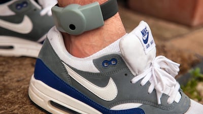 An electronic ankle tag is fitted to an offender in the UK. A law introducing tags was passed by the FNC in September last year.
