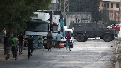 Palestinian youths run amid clashes that erupted after Israeli soldiers demolished a house at the Asker camp for Palestinian refugees east of Nablus city in the occupied West Bank. AFP