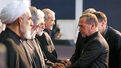 Deputy chairman of Russia's Security Council Dmitry Medvedev greets Iranian officials in Tehran. EPA
