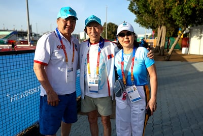 Radnaa Tseren, a 91-year-old athlete from Mongolia, with his son Badrakh and daughter Bayarchimeg in Abu Dhabi. Victor Besa / The National