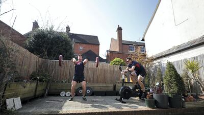 Morgan Bolding (left) and Josh Bugajski (right) housemates and members of the Great Britain Rowing Team train together in their garden in Henley-on-Thames, England. Getty