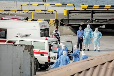 Health personnel return from the MV Hondius at the port of Praia, the capital of Cape Verde, on Wednesday. AFP