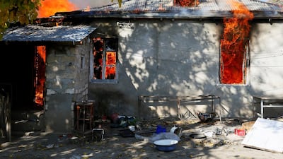 A house is seen set on fire by departing Ethnic Armenians, in an area which in the village of Cherektar in the region of Nagorno-Karabakh. Reuters
